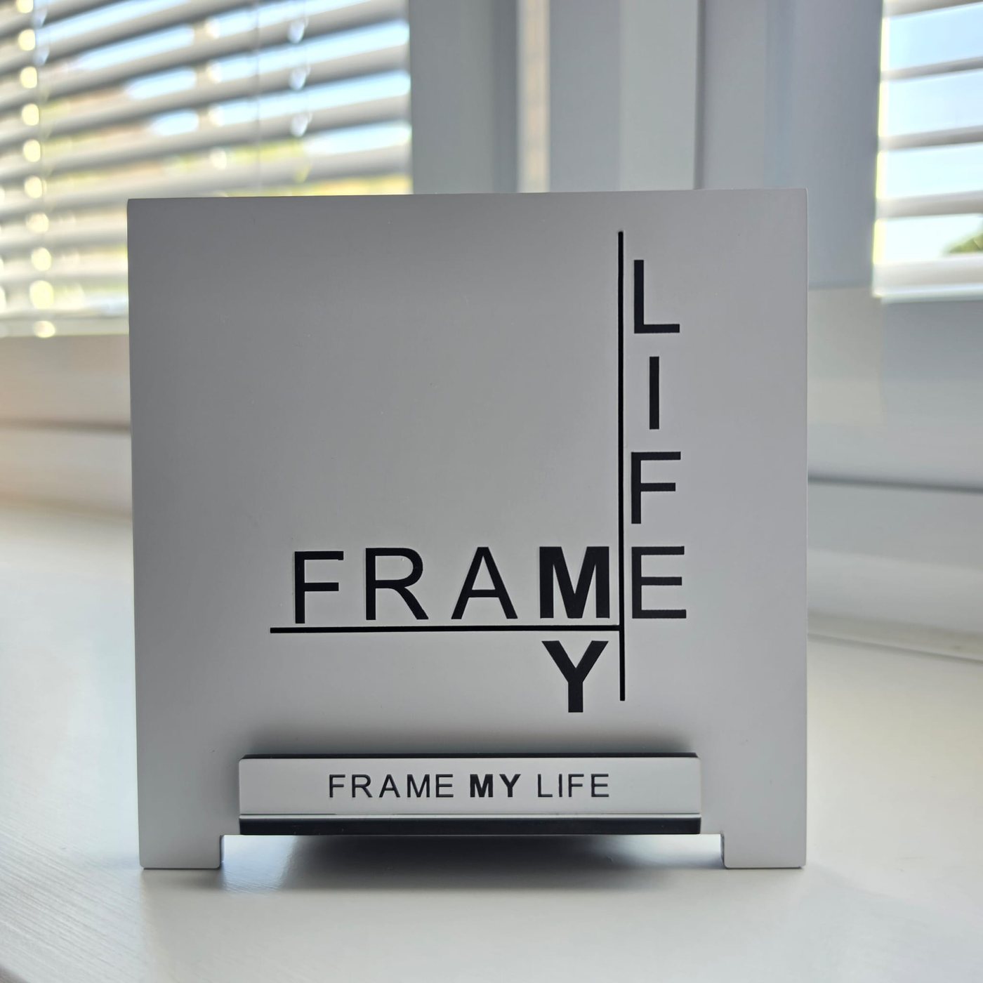 The Frame My Life display stand